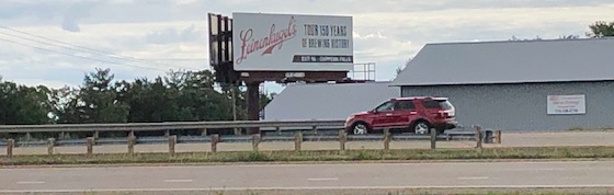 car passing billboard